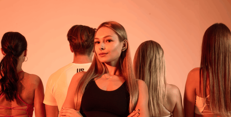 A group of people training in a fitness club symbolising the strength, energy and effects of creatine supplementation