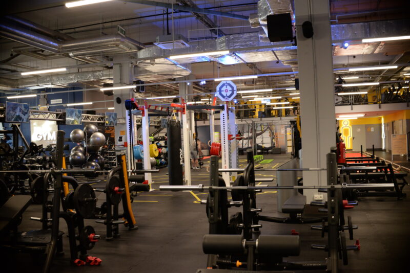 Modern functional and strength area Just Gym Poznań Bulgarska - training equipment, boxing bags and barbells.