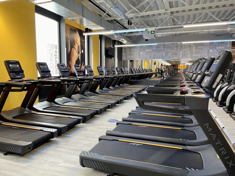 A row of treadmills in the Just Gym Gniezno - a spacious cardio zone with modern fitness equipment by Matrix.